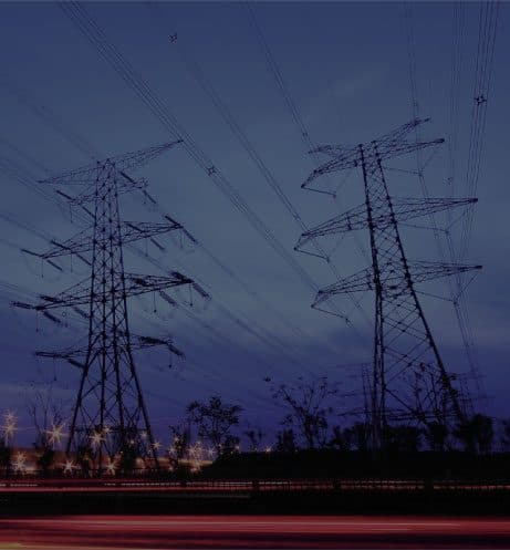 Power transmission towers at night